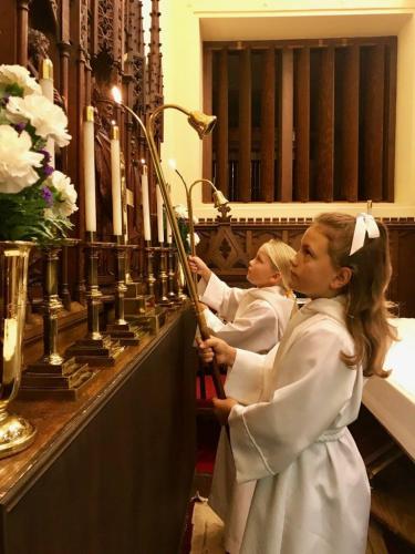children-lighting-candles